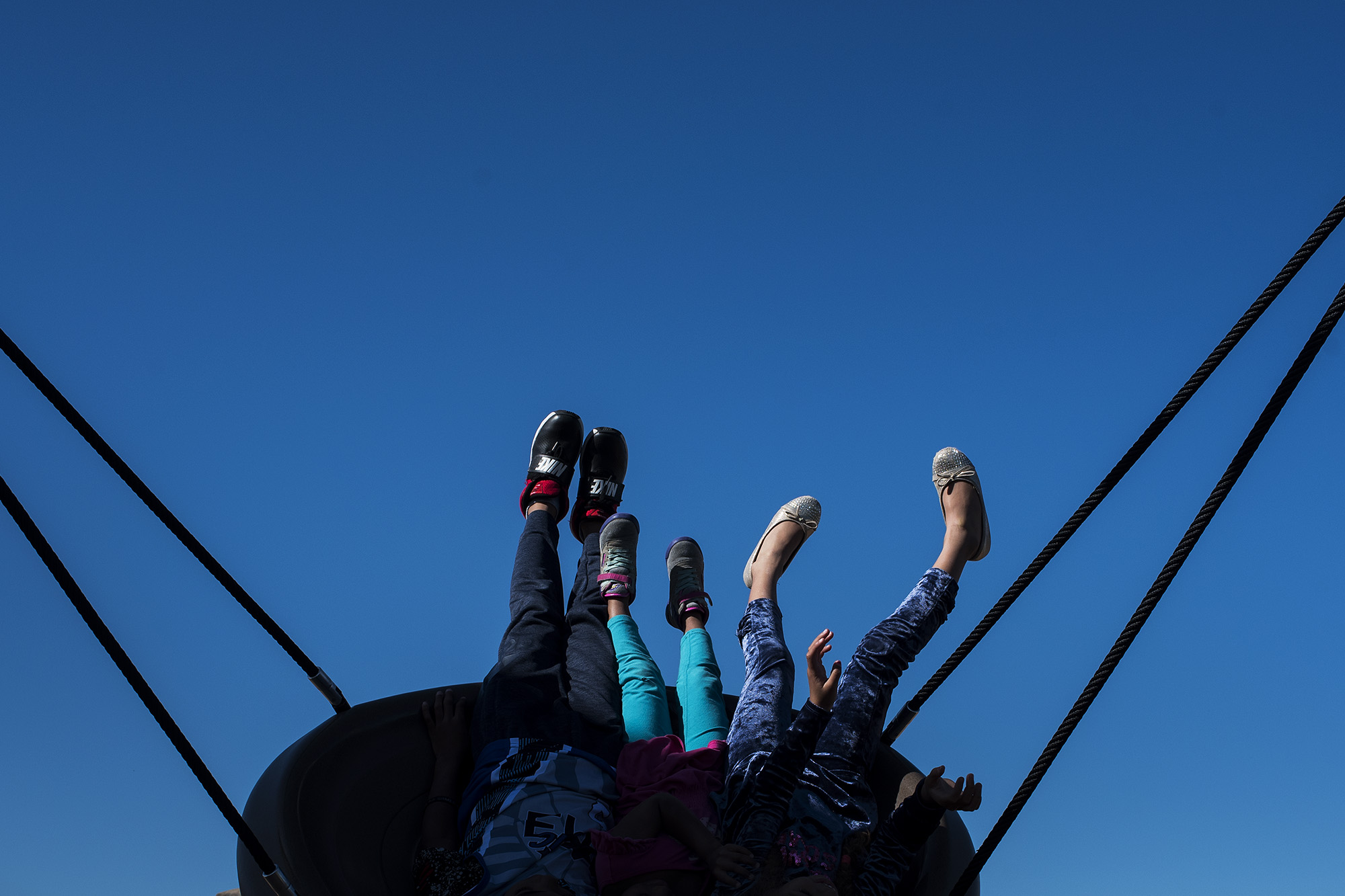 kids feet on swing - documentary family photography