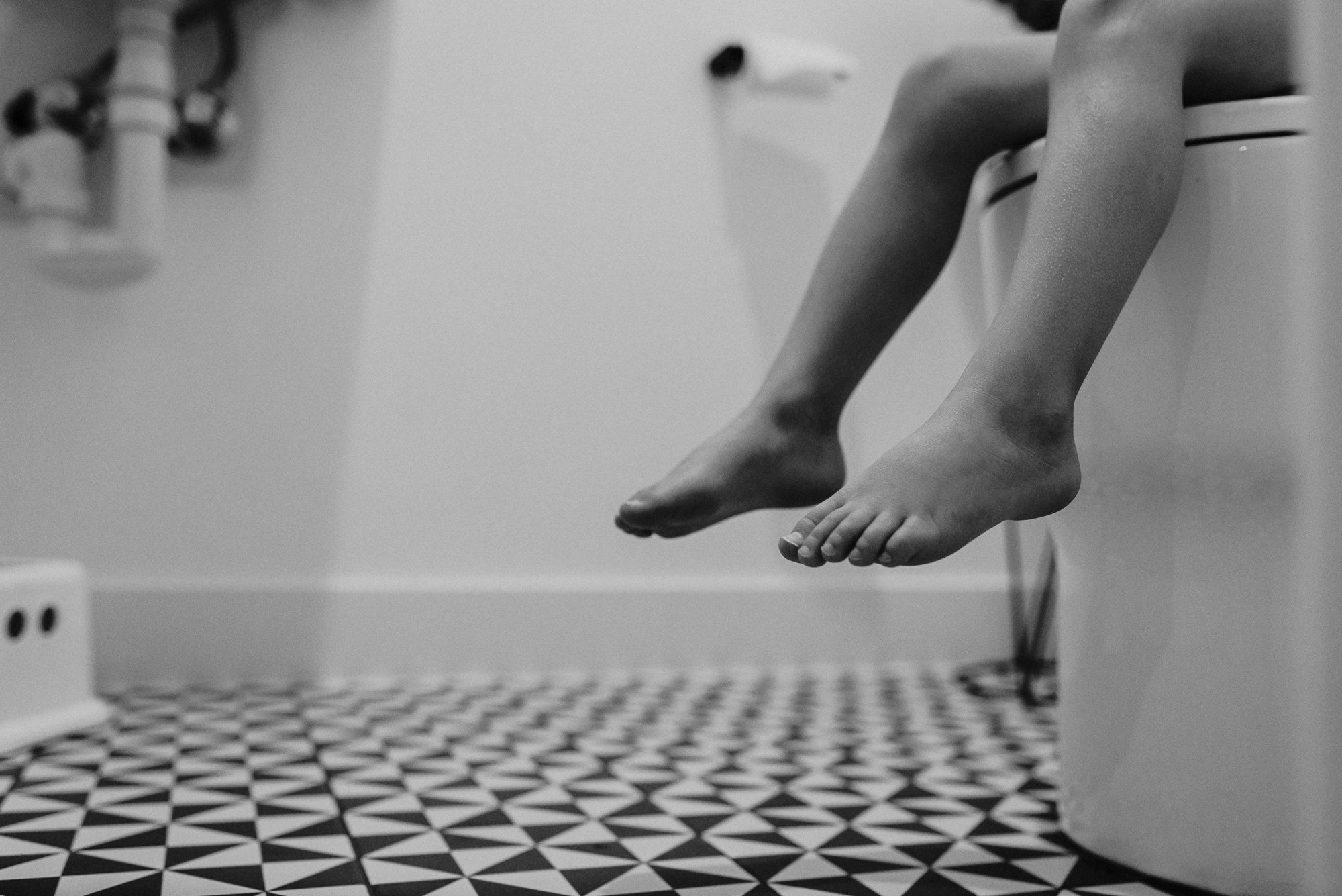 toddler feet on toilet - documentary family photography