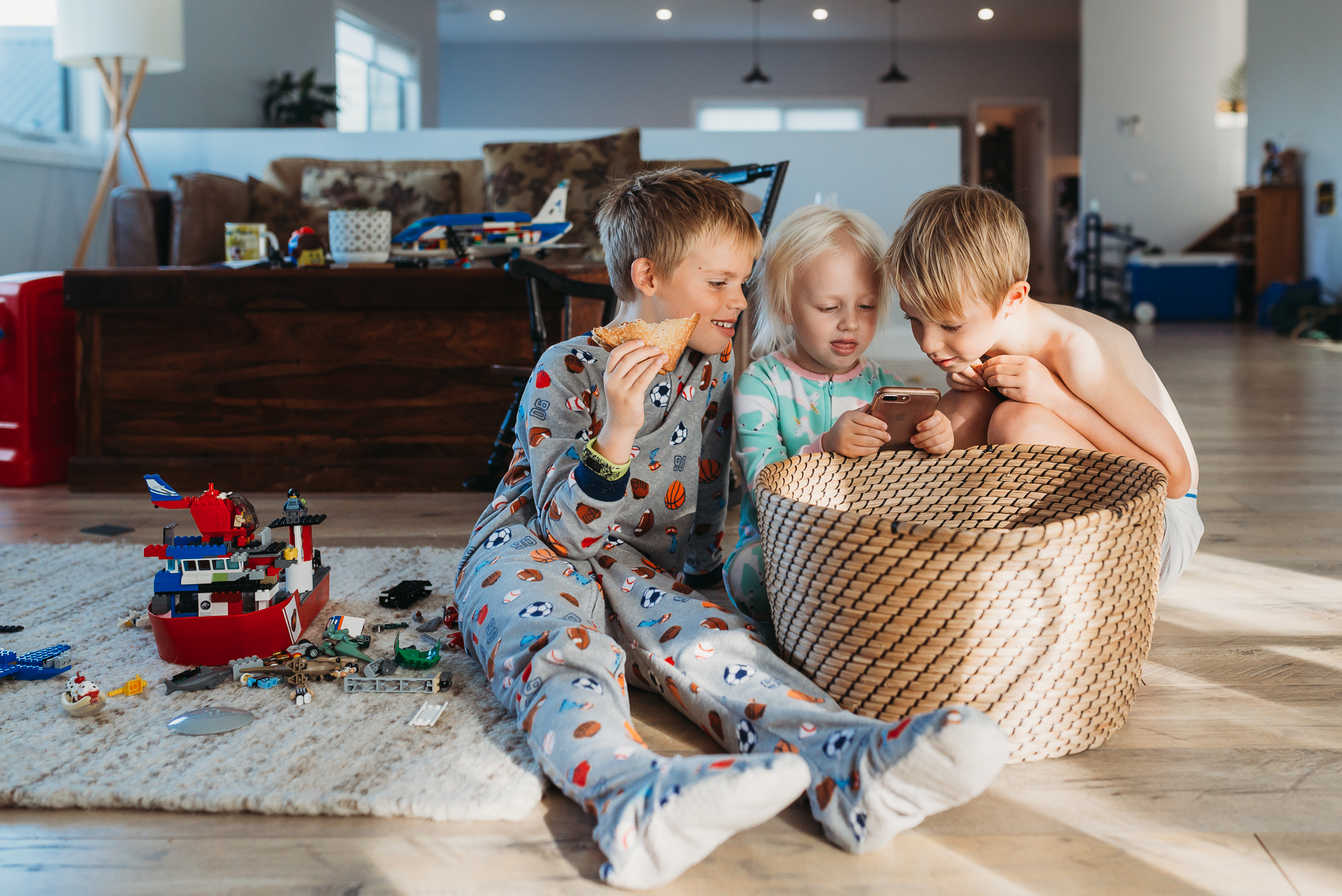 kids peering in basket - documentary family photography