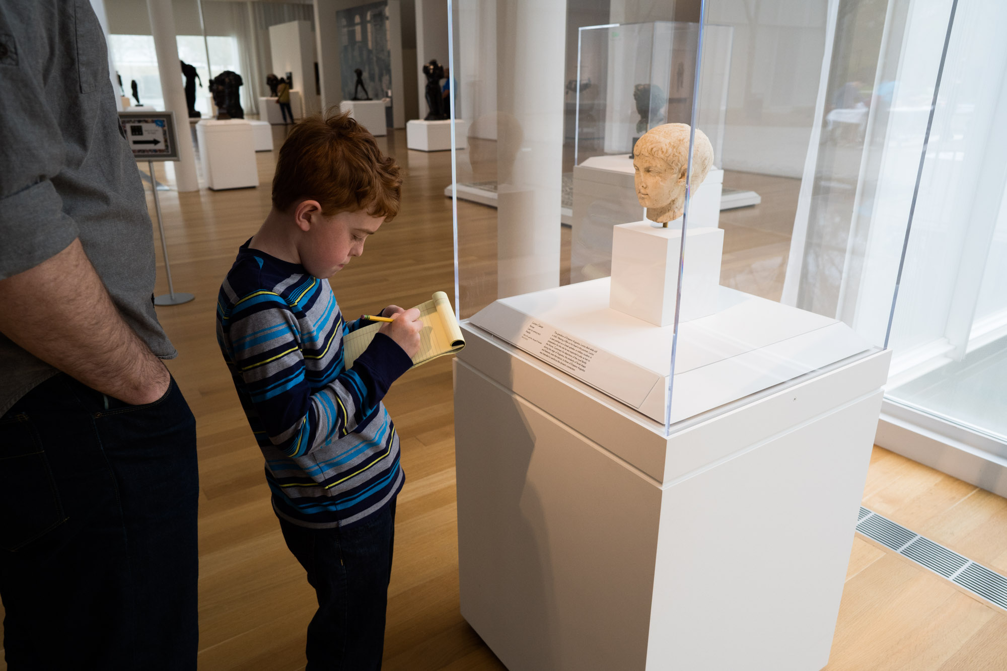 boy at museum display - documentary family photography