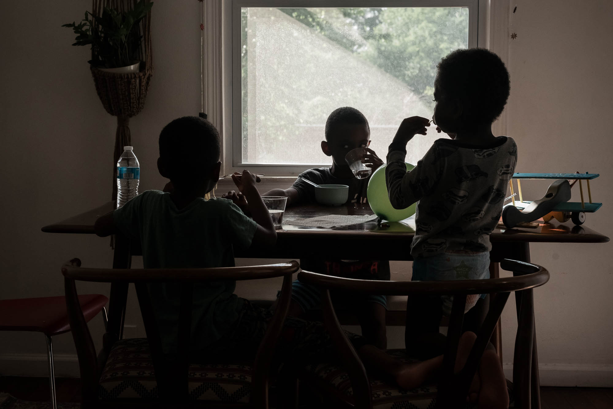 boys eating at table - documentary family photography