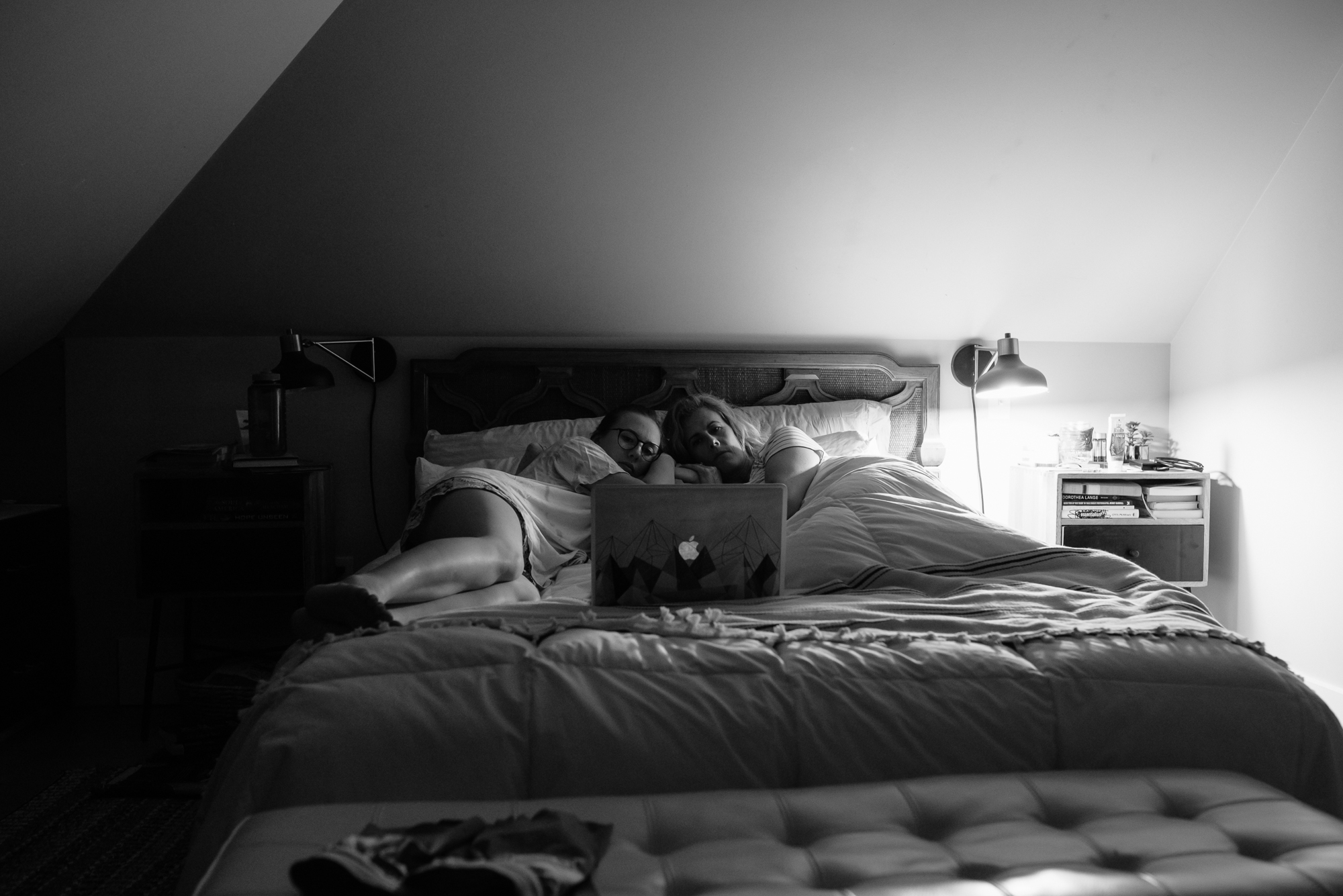 family watching movie on bed - documentary family photography