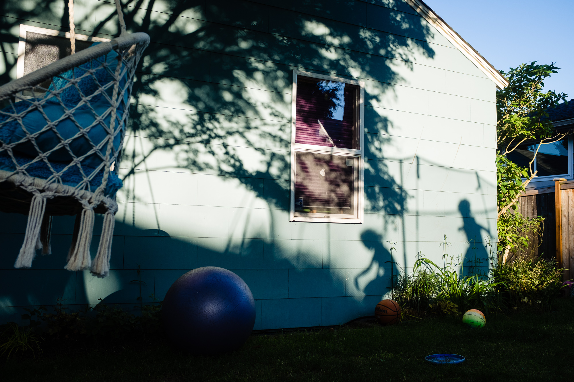 shadows of kids on trampoline- documentary family photography