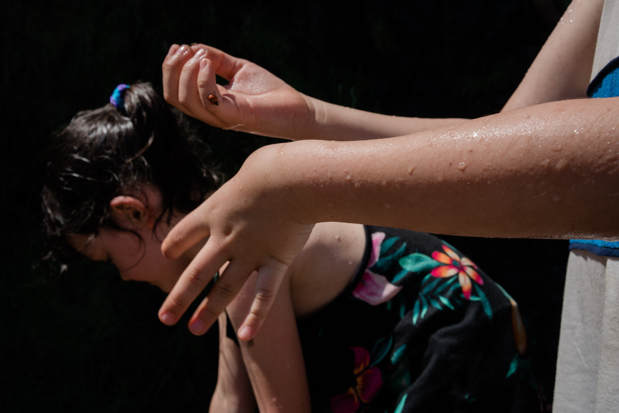 hands and girl in swimsuit - documentary family photography