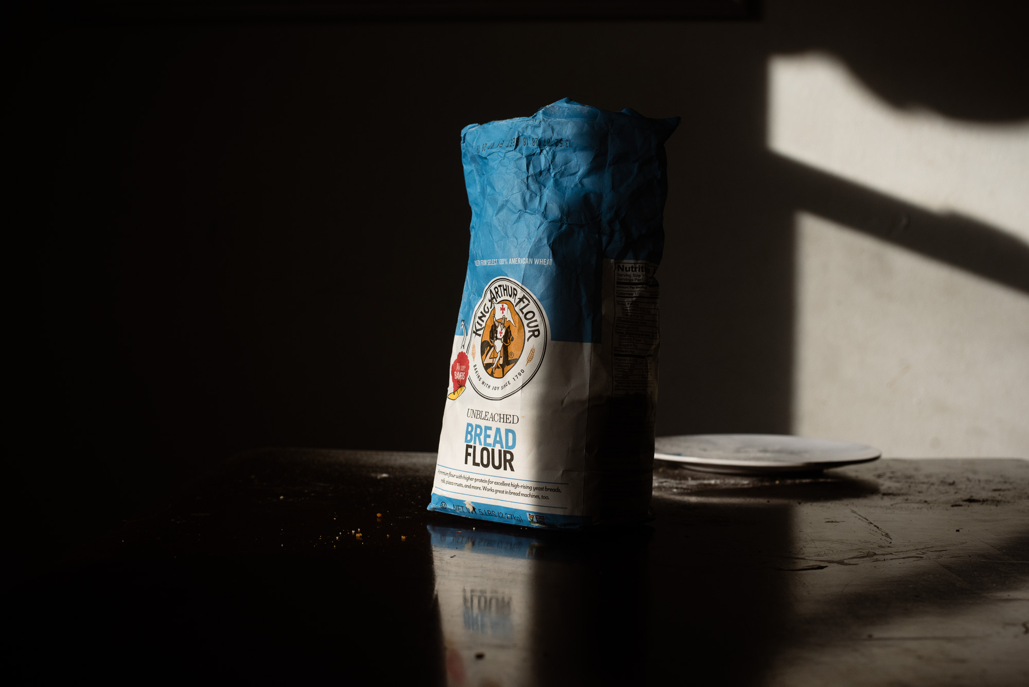 sack of flour in sunlight - documentary family photography