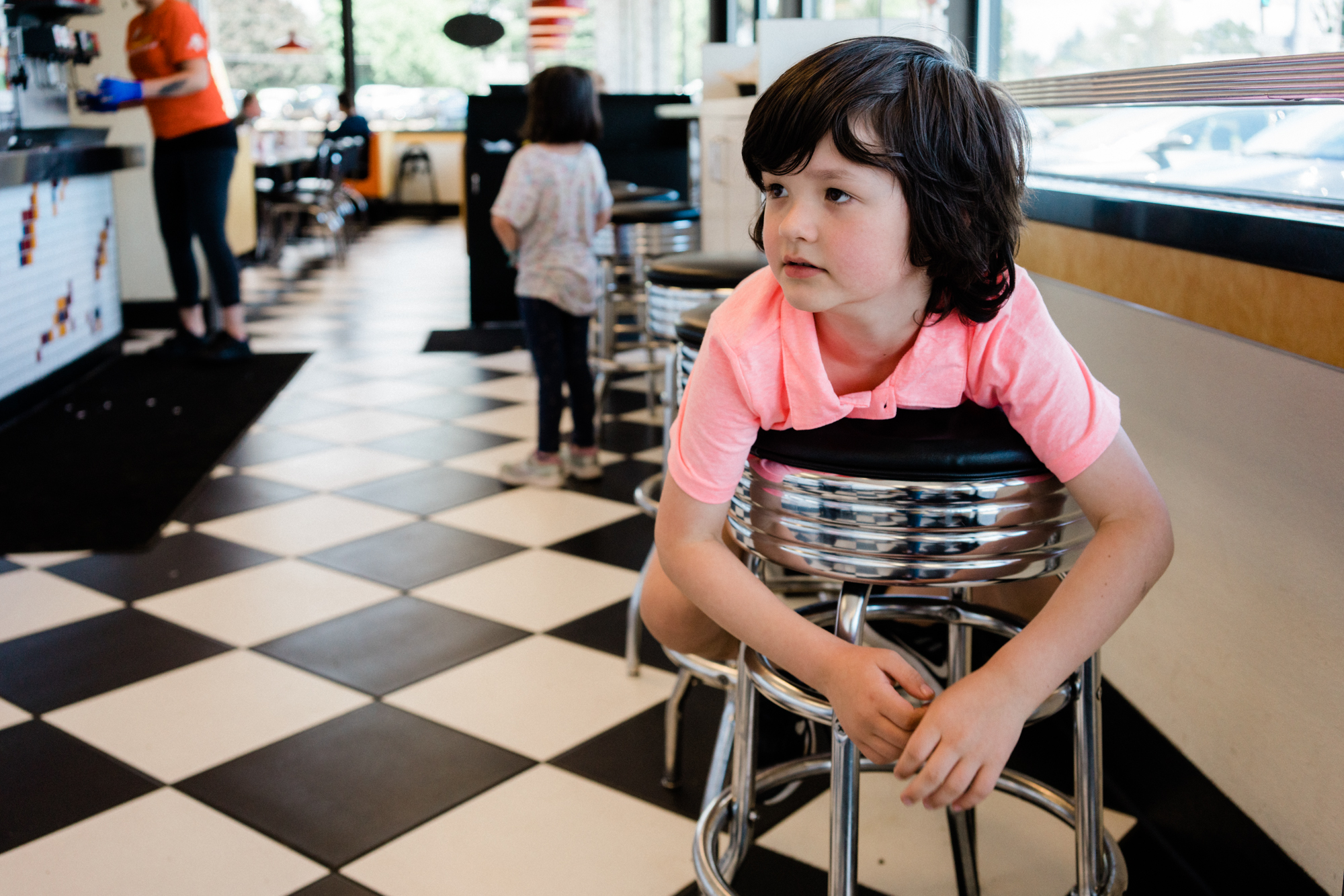 child at cafe - documentary family photography