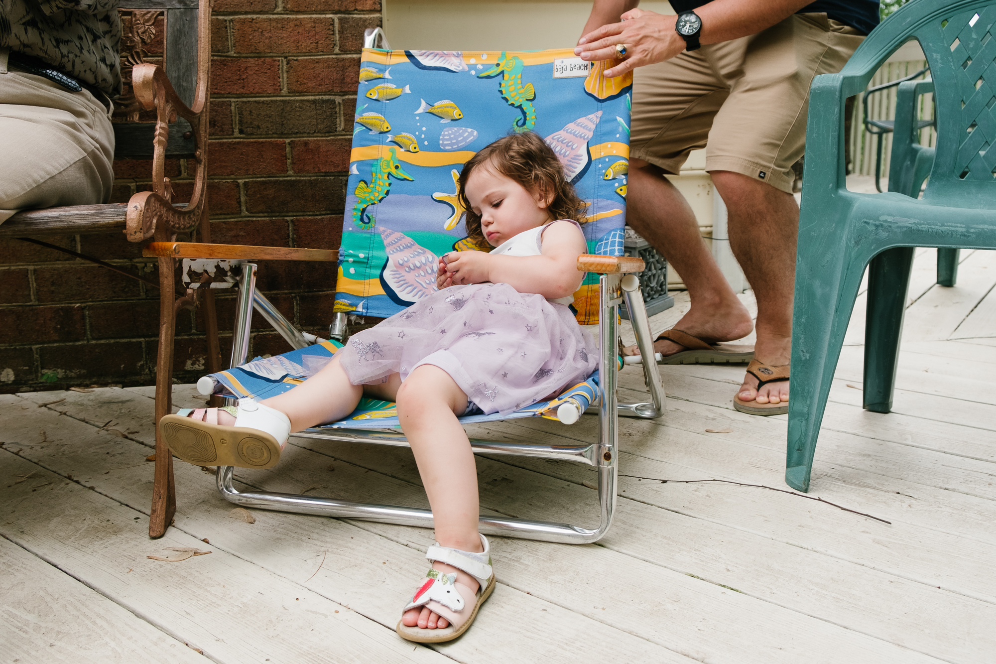 bored girl in lawn chair - documentary family photography