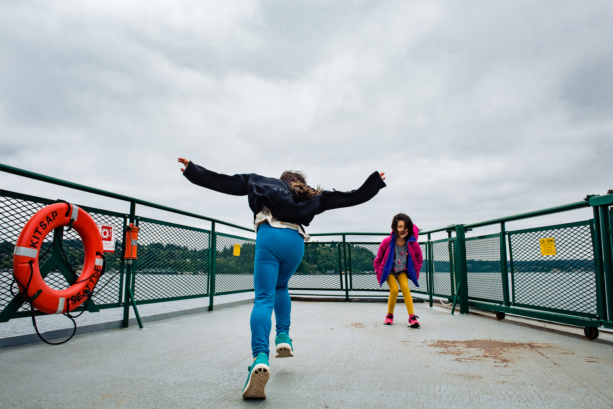 kids play on ferry - documentary family photography