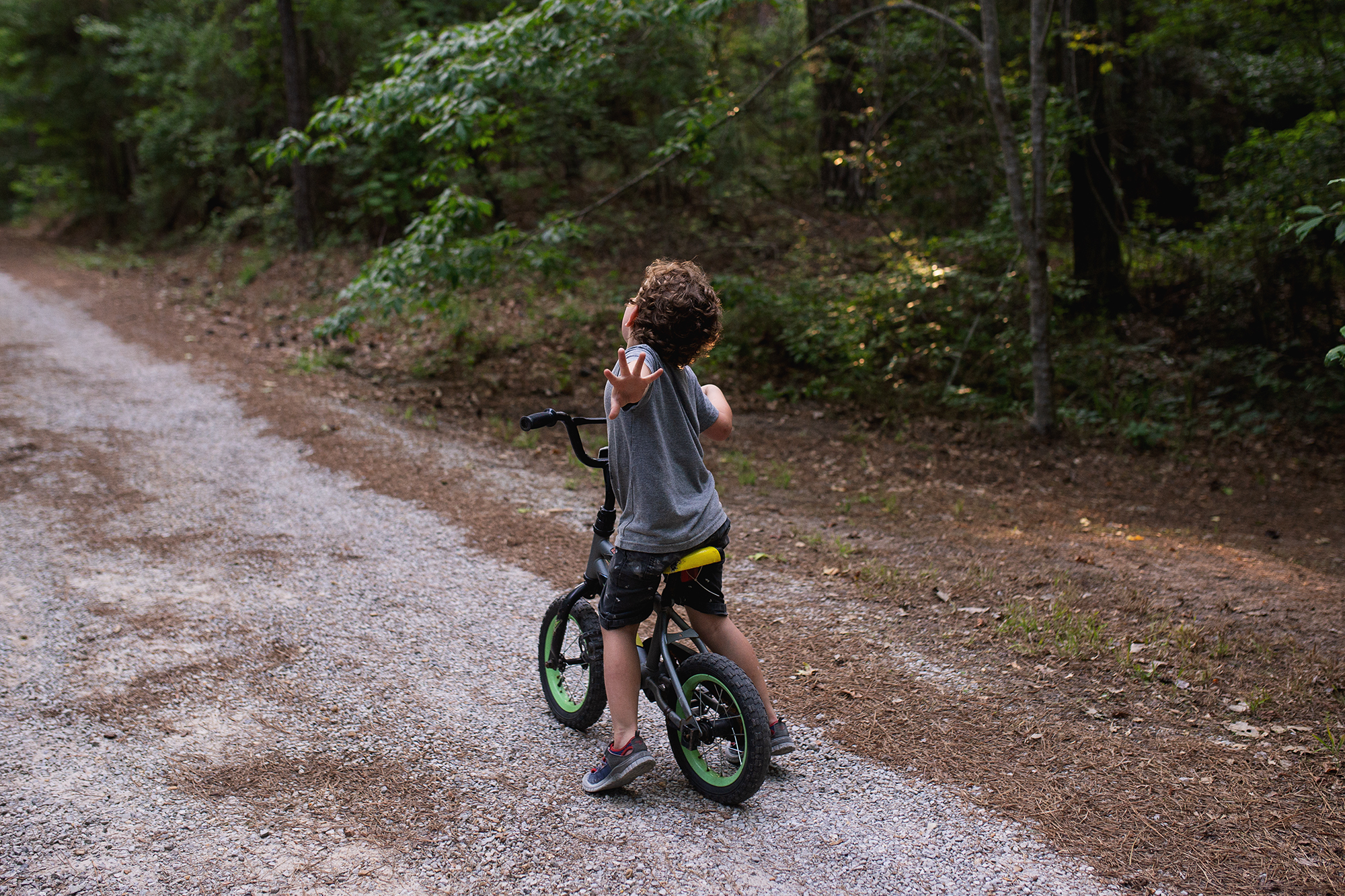 child on balance bike - documentary family photography