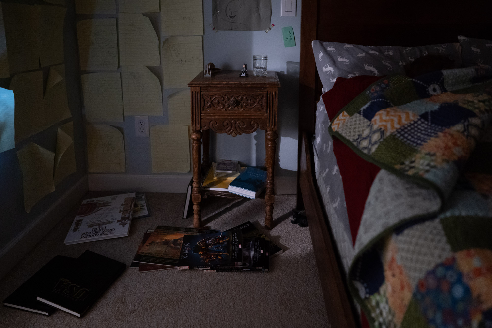 books on bedroom floor - documentary family photography