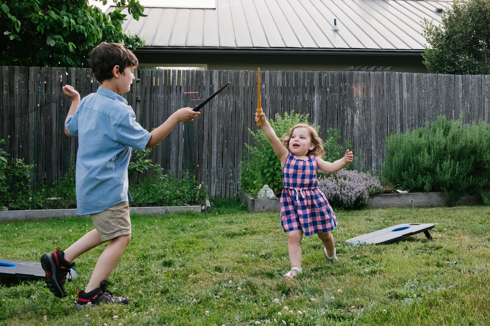 kids with toy wands - documentary family photography