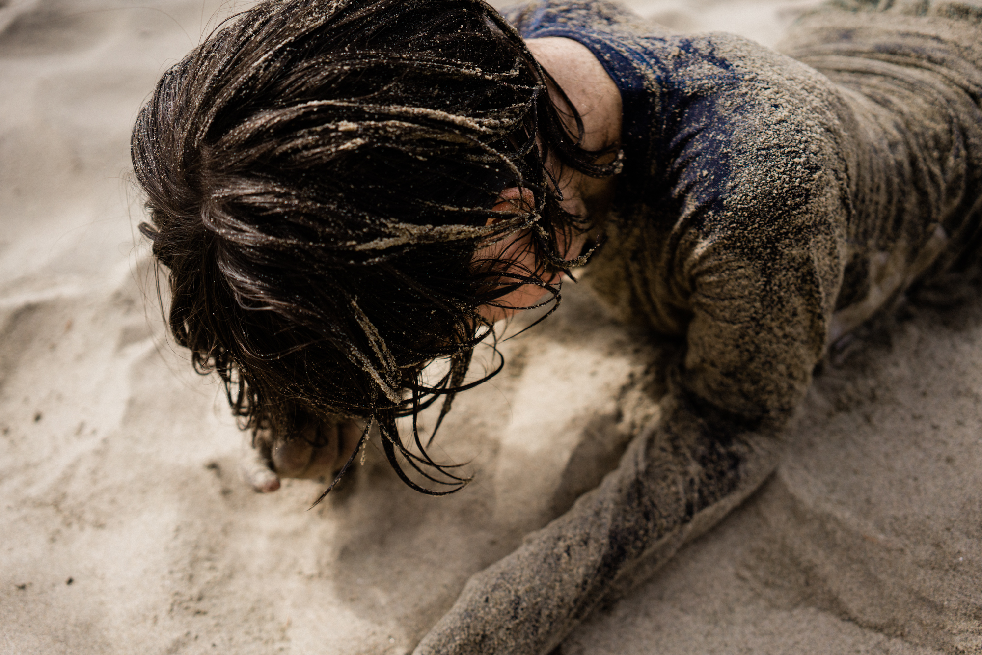 child in sand - documentary family photography