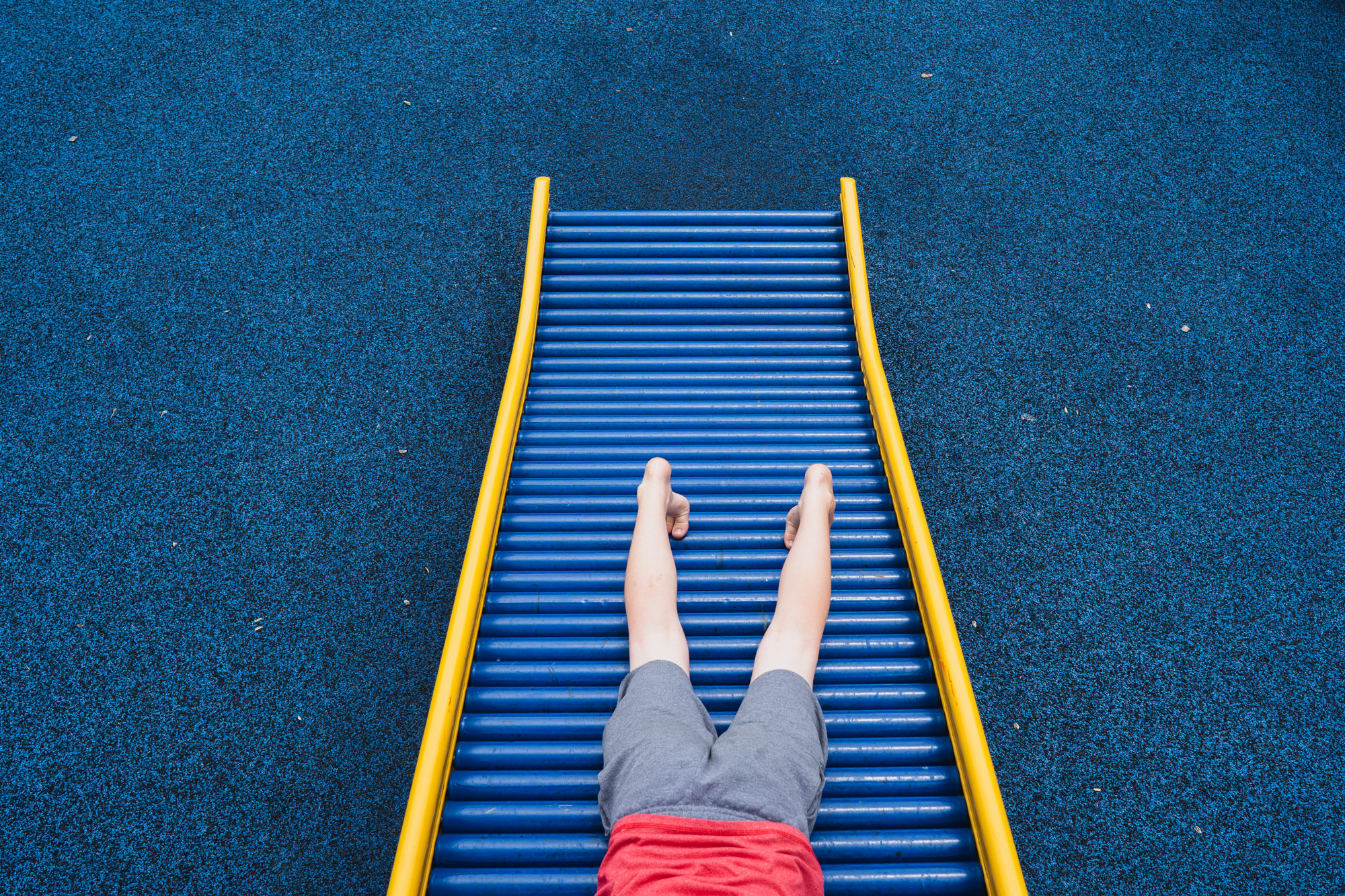 child on roller slide - documentary family photography