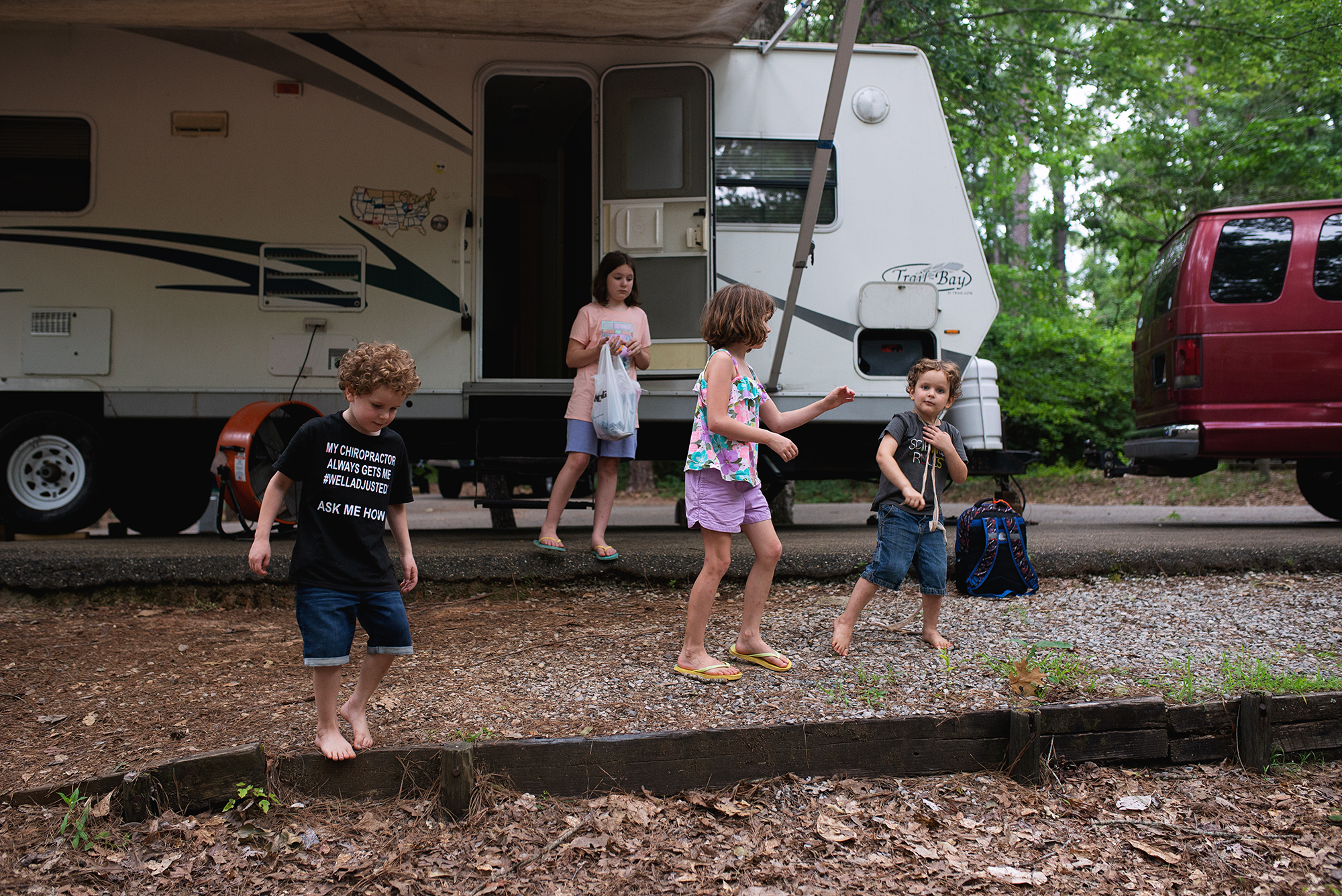 kids outside camper - documentary family photography