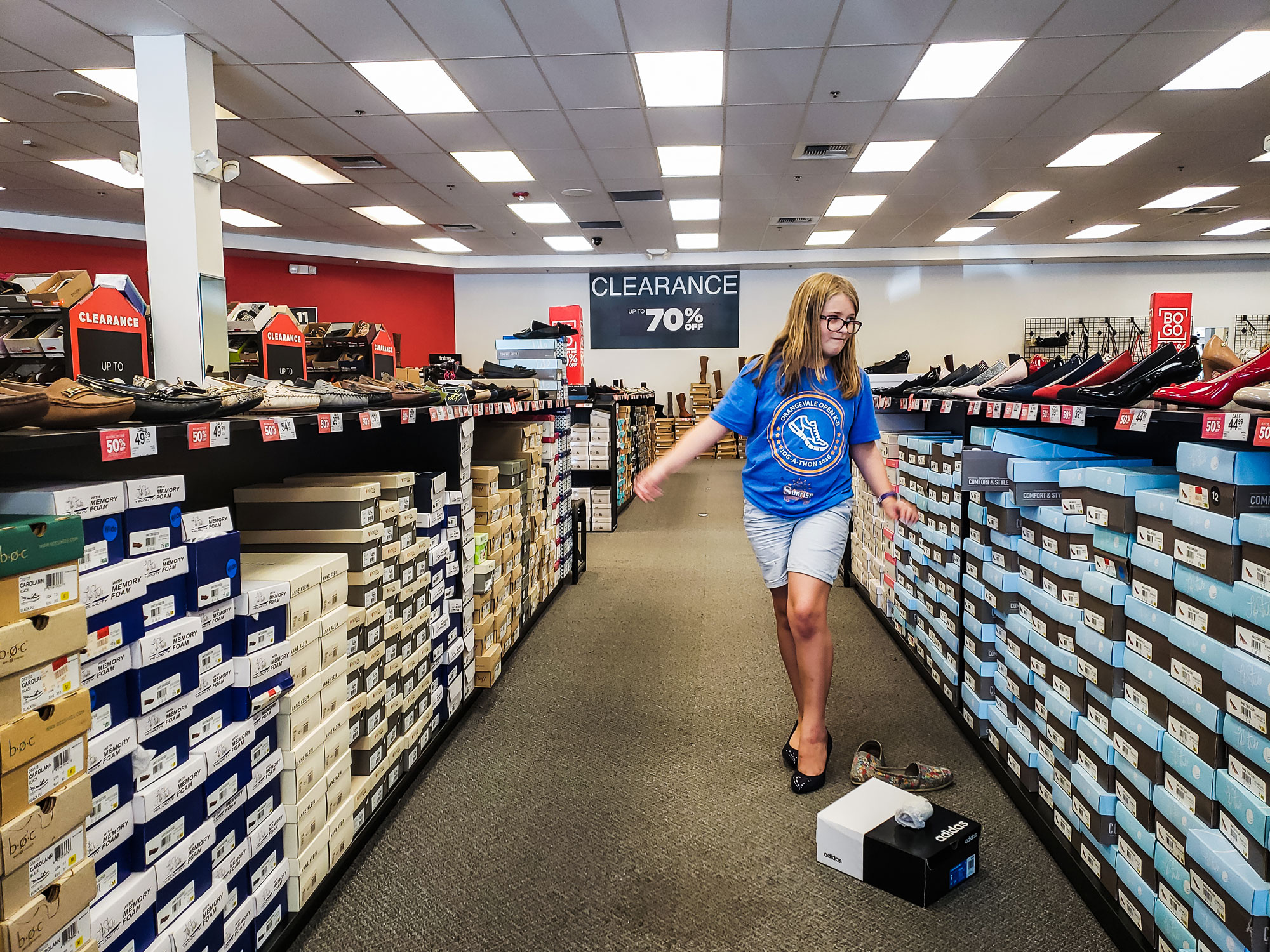 girl in shoe store - documentary family photography