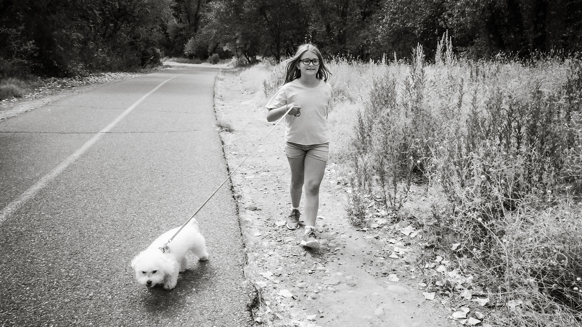 girl running with dog - documentary family photography